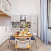 The kitchen is very accessible from the living room.