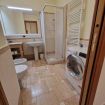 full bathroom with washing machine